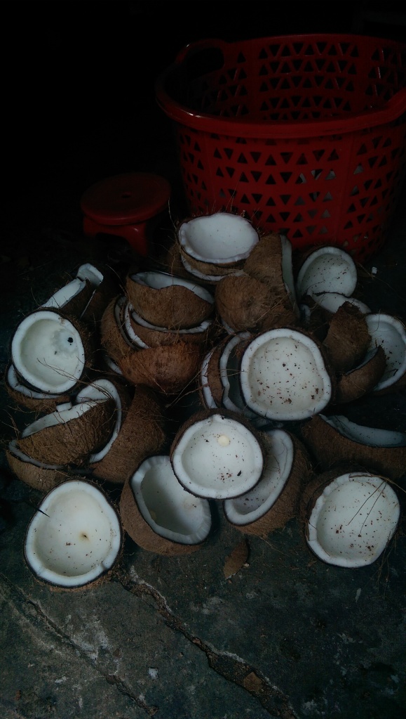 Coconuts are then scraped of their flesh before being pressed