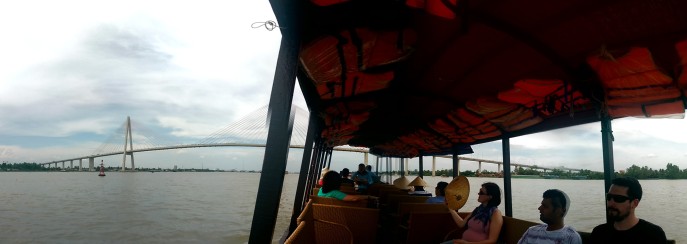 Cruising the Mekong under the giant suspension bridge